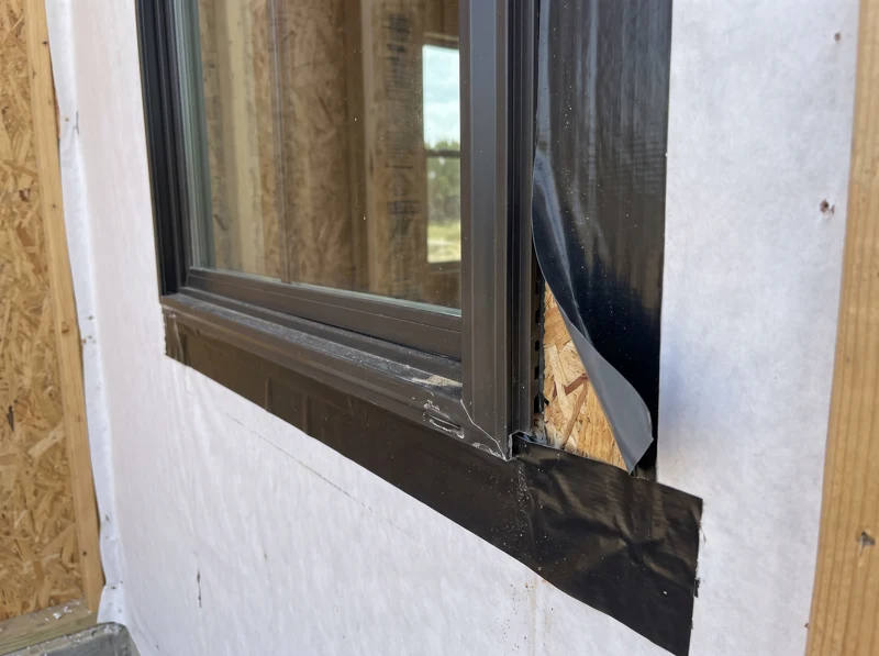 Illustrative sample: lifted window flashing