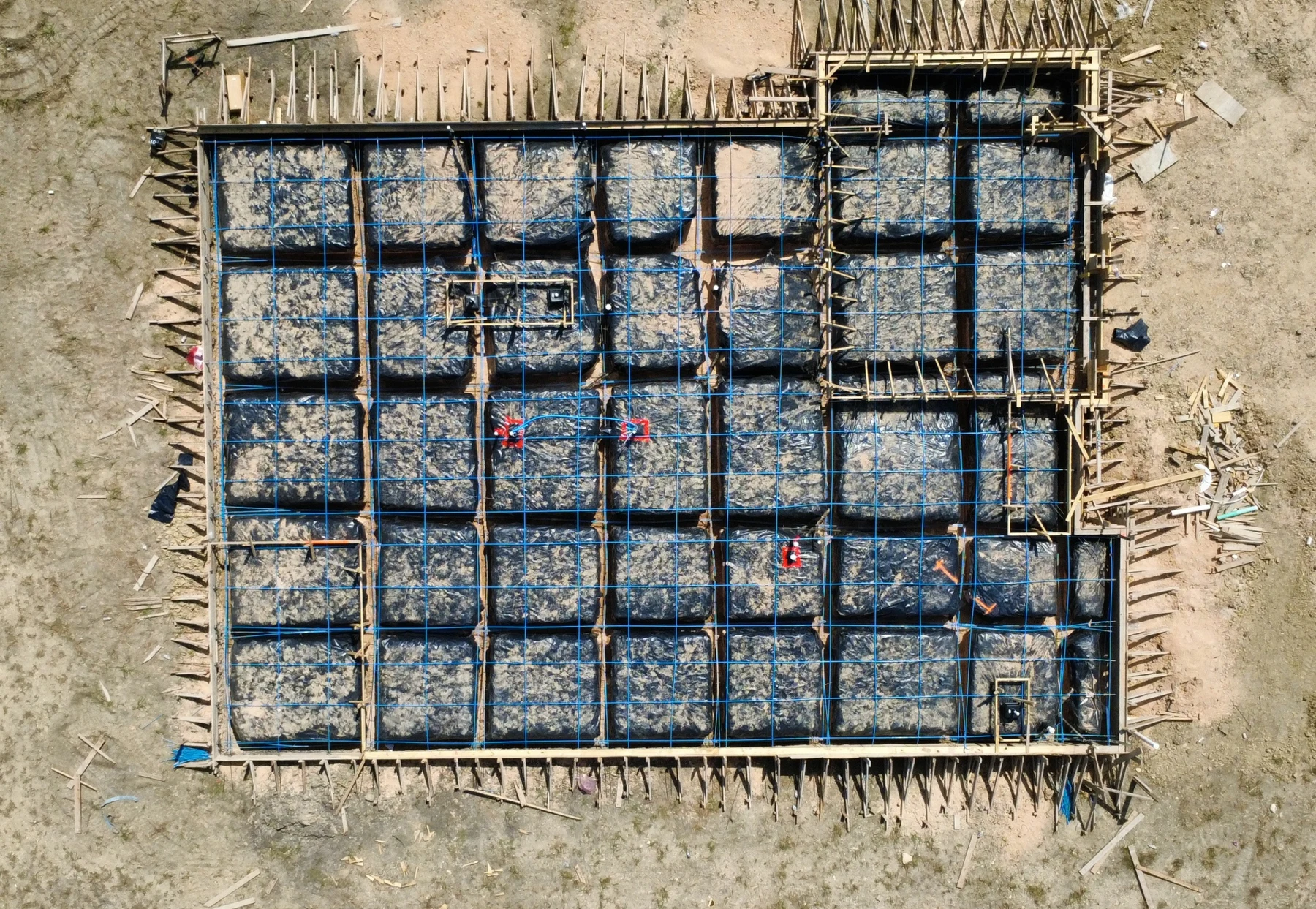 Aerial photograph of prepared foundation before concrete placement, from the sample inspection report