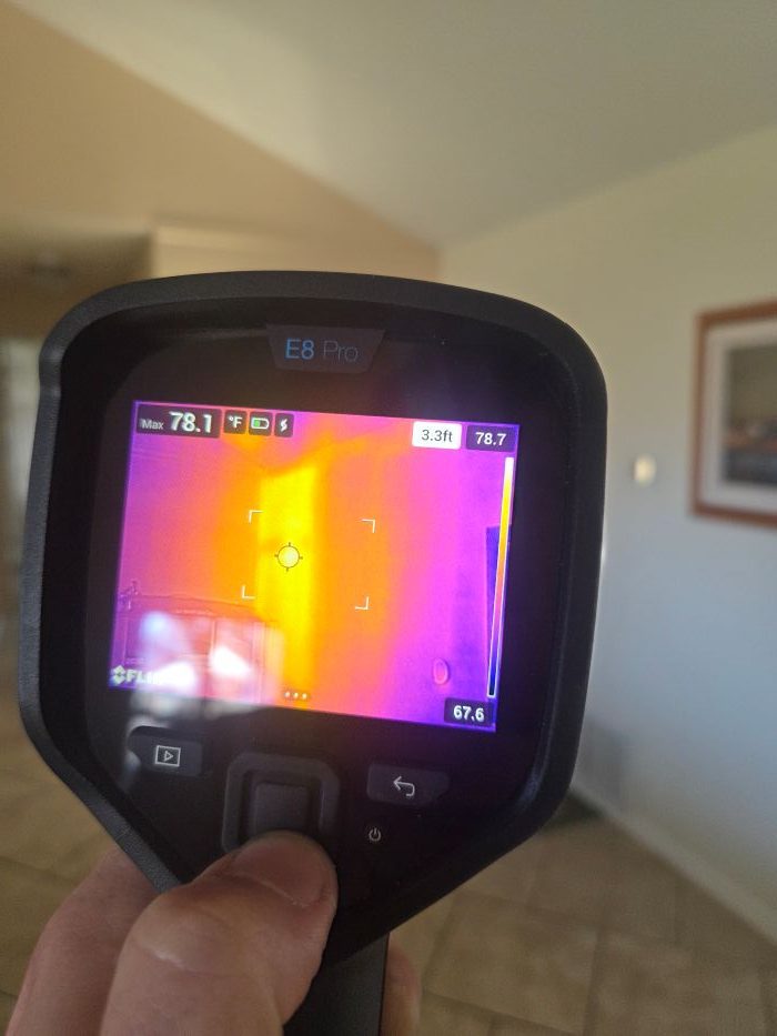 FLIR thermal camera showing a warmer area associated with missing insulation.